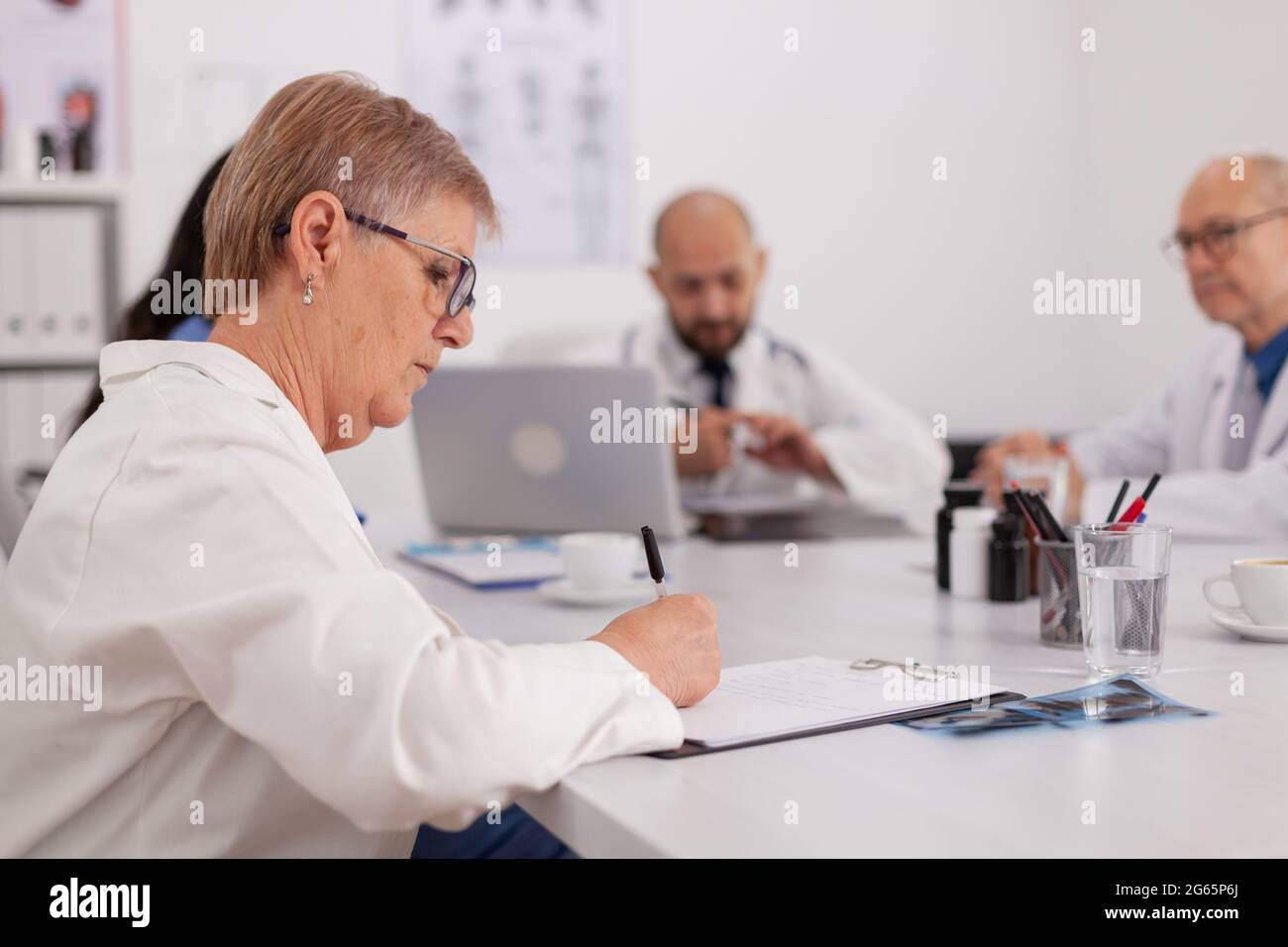 Hospital physician doctors working at medical expertise presentation