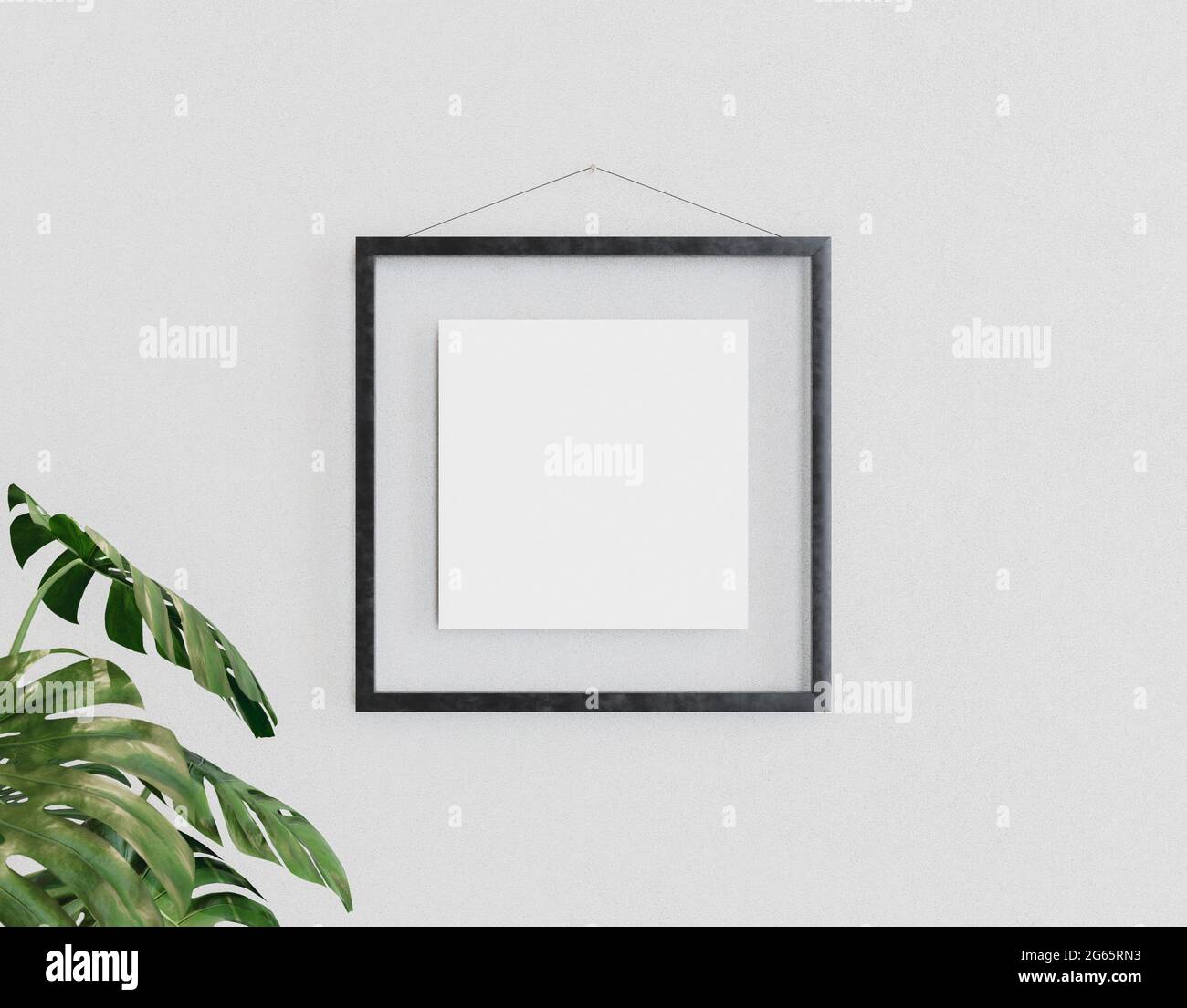 mockup of a square glass frame hanging on the wall with a plant next to it. 3d render Stock