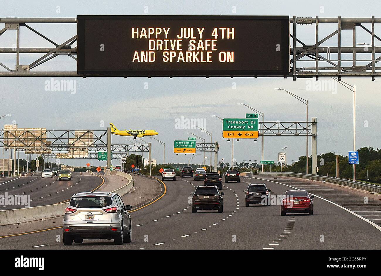 A Happy July 4th sign greets drivers near Orlando International Airport