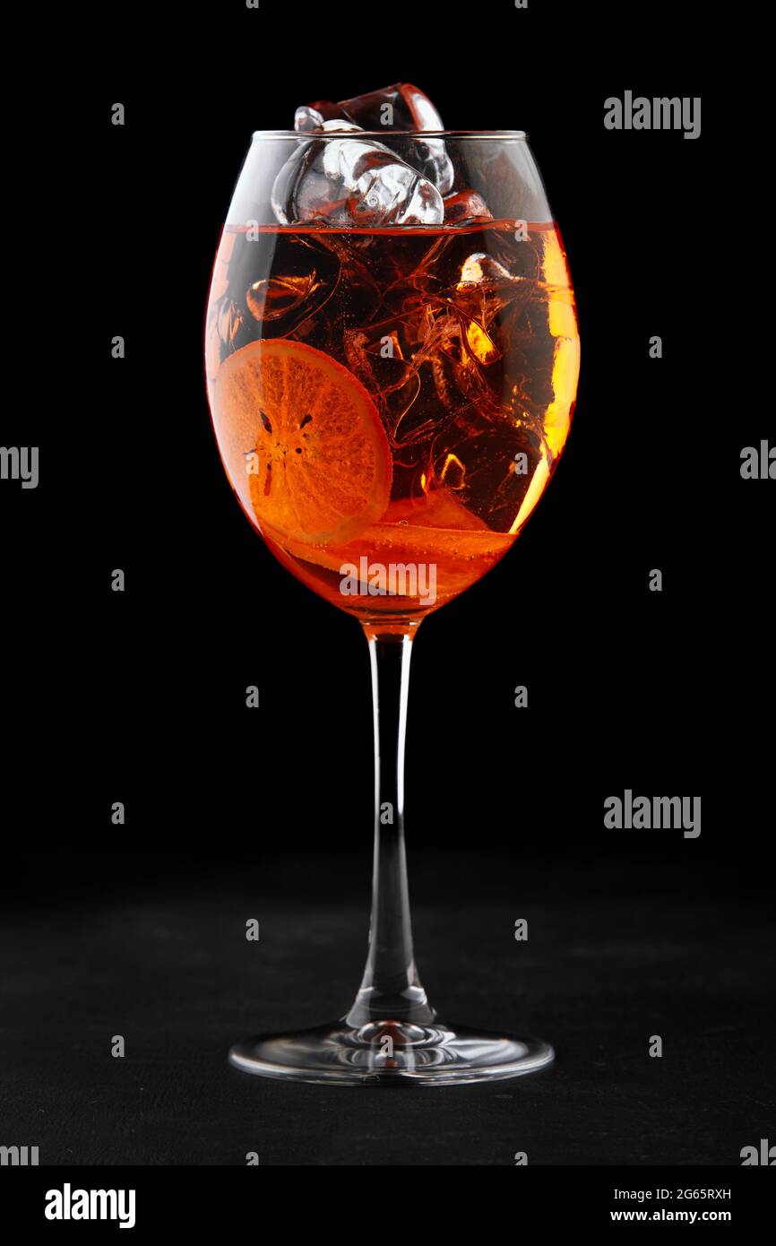 Cocktail aperol syringe with ice, on a black background Stock Photo