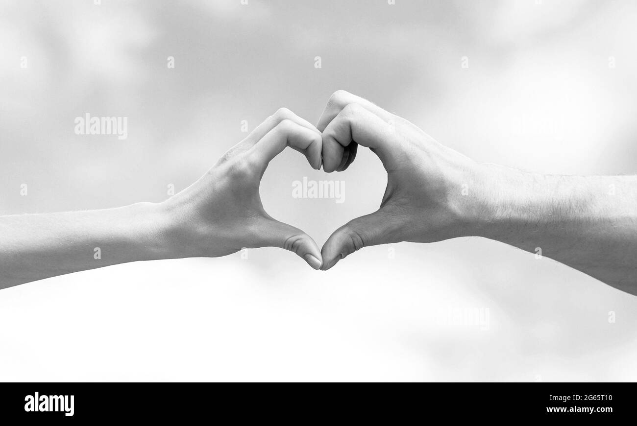 Love, friendship concept. Girl and male hand in heart form love blue ...