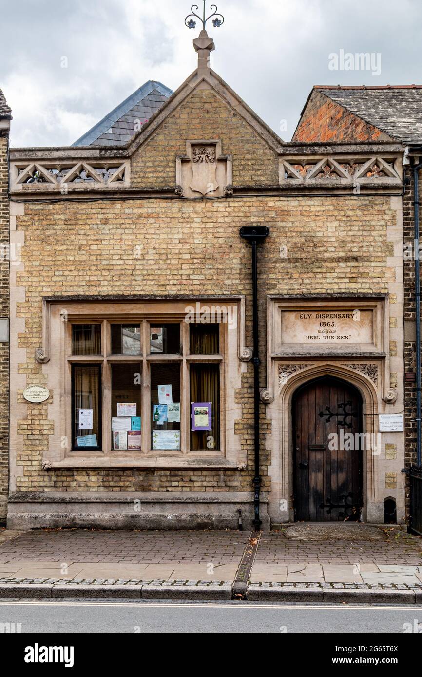 The Ely Dispensary, built in 1865, is now a community space.  Above the door is a plaque engraved with 'Heal the Sick'. Stock Photo