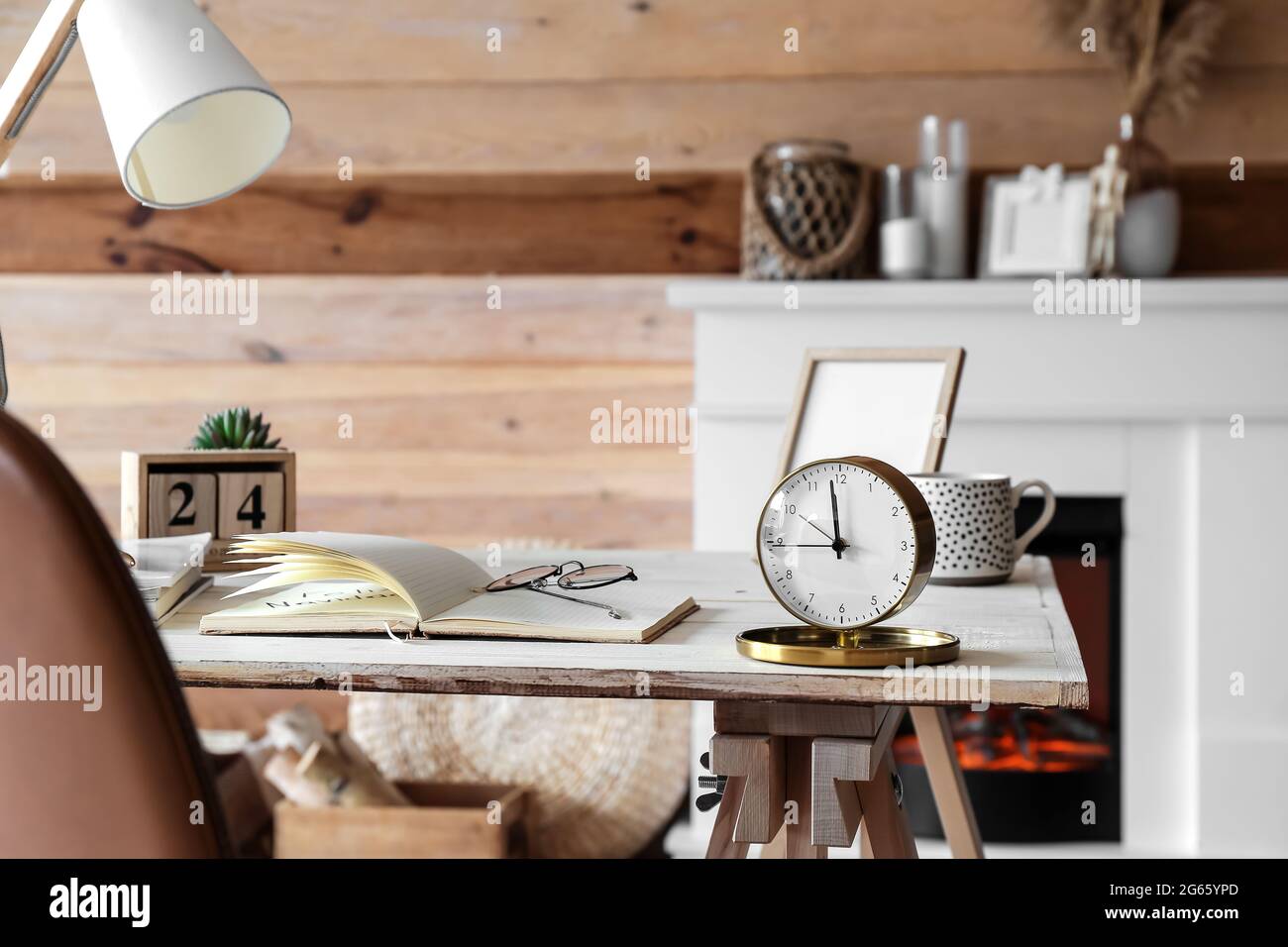 Modern workplace with alarm clock in interior of stylish room Stock ...
