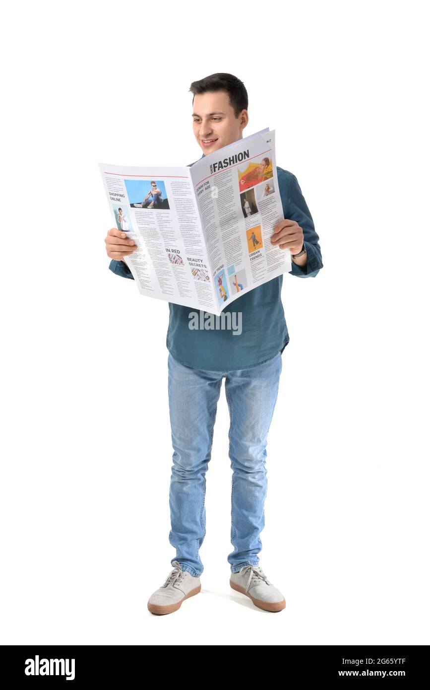 Young man reading newspaper on white background Stock Photo - Alamy