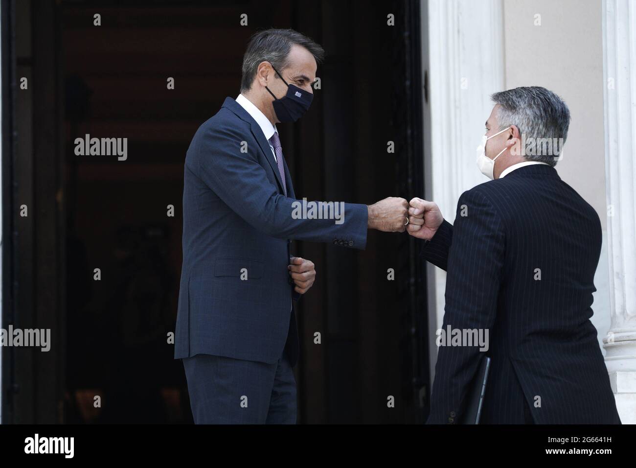 (210703) -- ATHENS, July 3, 2021 (Xinhua) -- Greek Prime Minister Kyriakos Mitsotakis (L) welcomes Organization for Economic Co-operation and Development (OECD) Secretary-General Mathias Cormann in Athens, Greece, July 2, 2021. International cooperation is more important than ever to deal with the challenges of our time, Mathias Cormann said on Friday during a visit to Athens. (Photo by Nick Paleologos/Xinhua) Stock Photo
