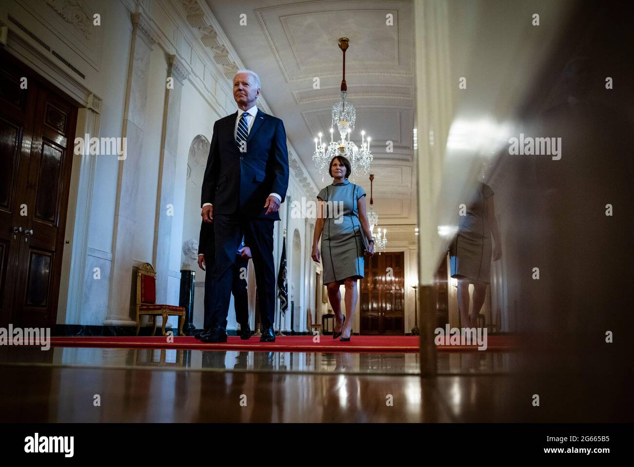U.S. President Joe Biden is followed by Alejandro Mayorkas (L), Secretary of the Department of Homeland Security, and Tracy Renaud (R), acting director of U.S. Citizenship and Immigration Services (USCIS), as they arrive for a naturalization ceremony in the East Room of the White House in Washington, DC, U.S., on Friday, July 2, 2021. The ceremony is to welcome citizens to the United States ahead of Independence Day. Credit: Samuel Corum/Pool via CNP /MediaPunch Stock Photo