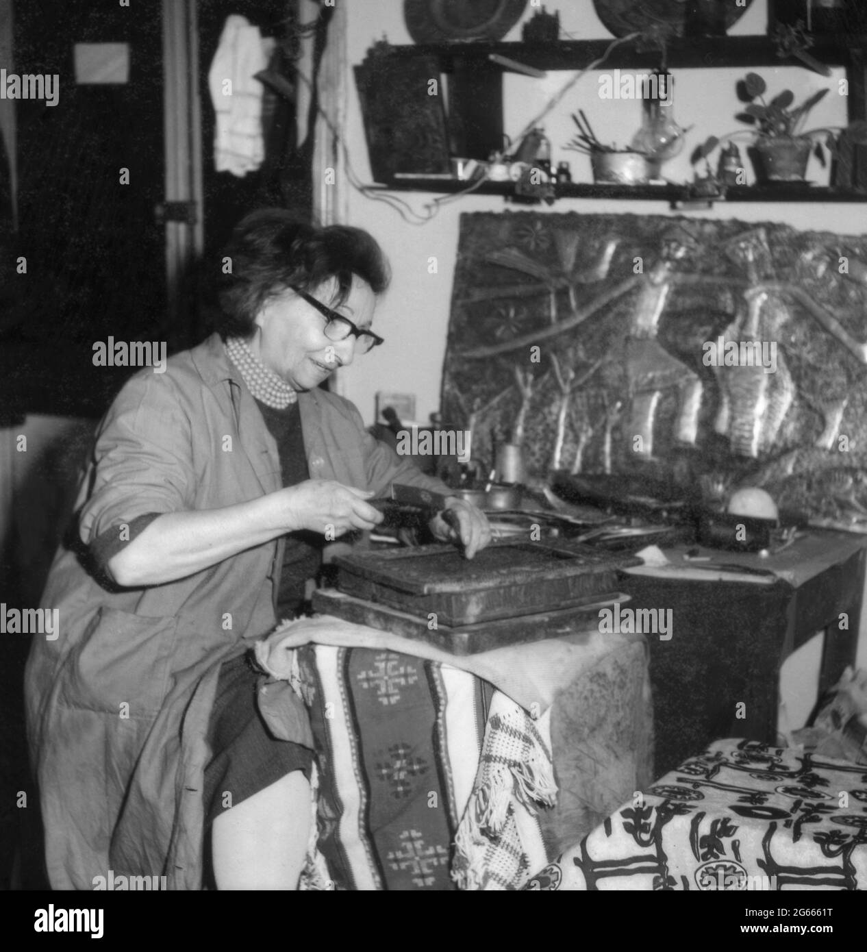 Bucharest, Romania, approx. 1975. Ana Mitrea, well known metal-smith artist in her workshop. Stock Photo