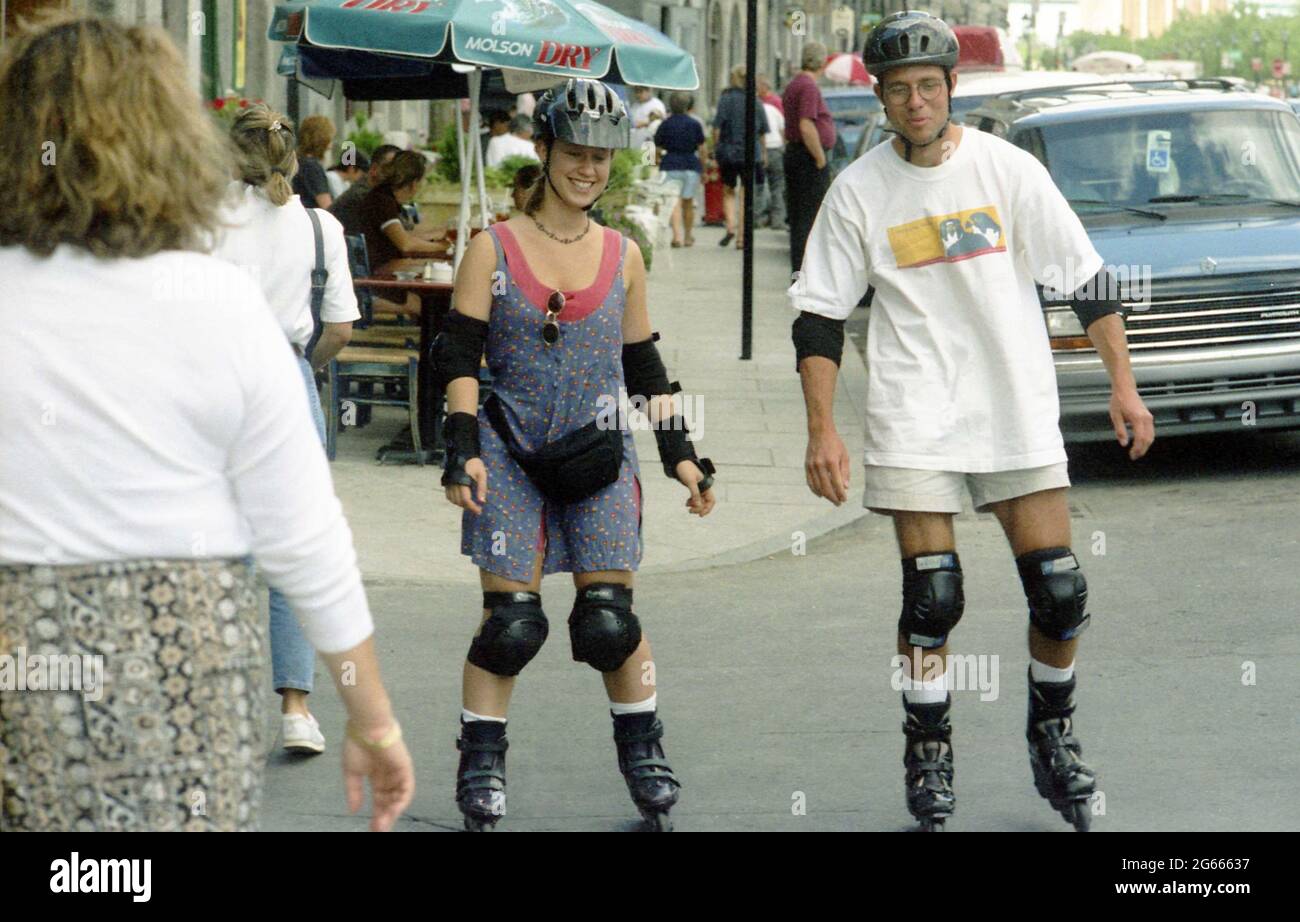 Canada, 1993. People roller skating on a city street. Stock Photo