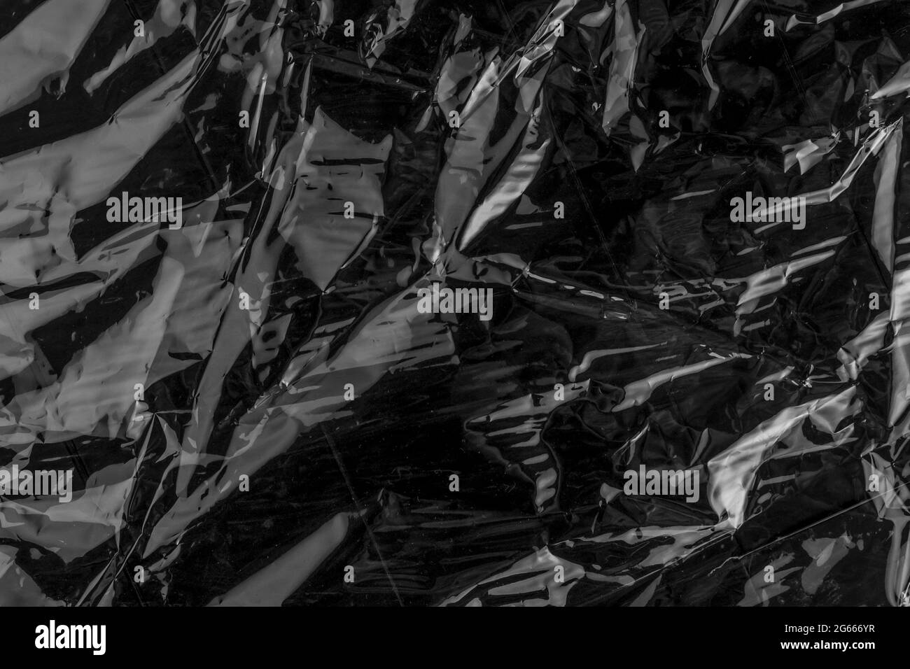 Wrinkled black shiny abstract background Stock Photo
