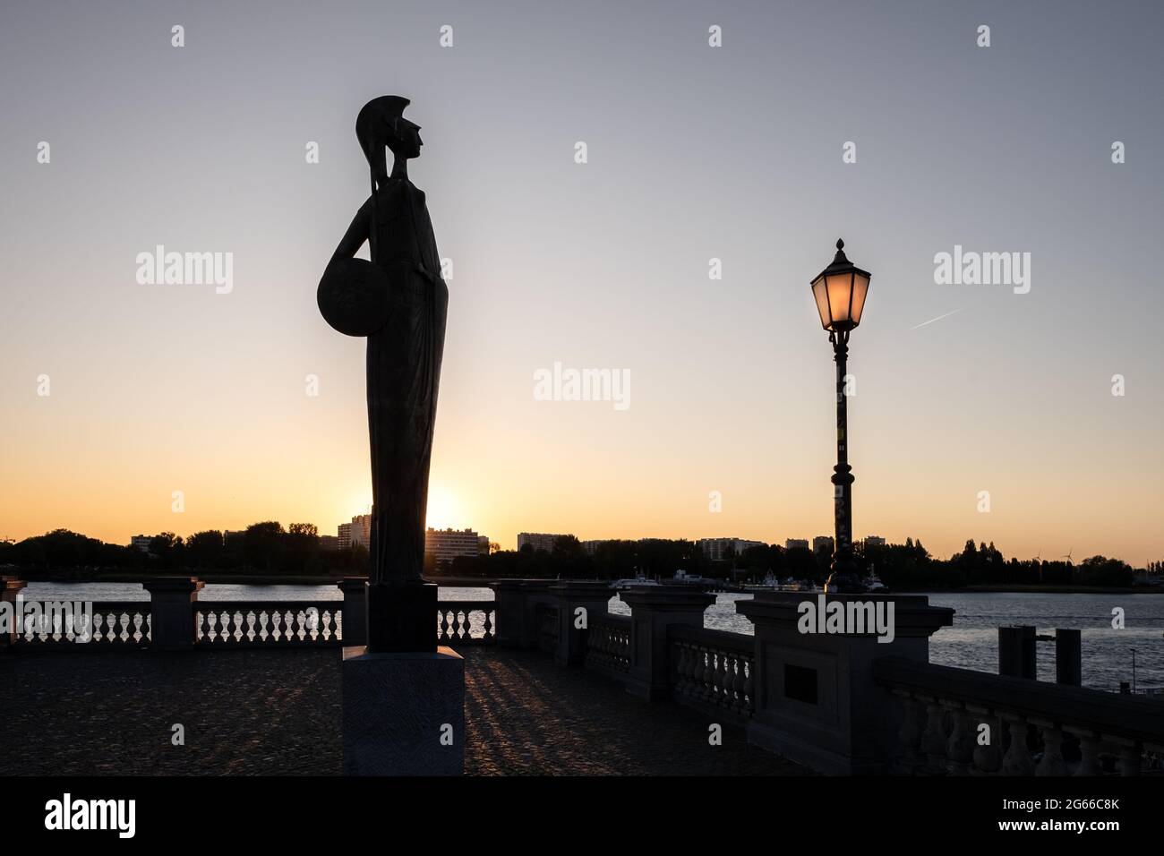 Silhouette of the Minerva Statue and a lamp post in the center of Antwerp, Belgium. Minerva was the Roman Goddess of wisdom and strategic warfare. Stock Photo