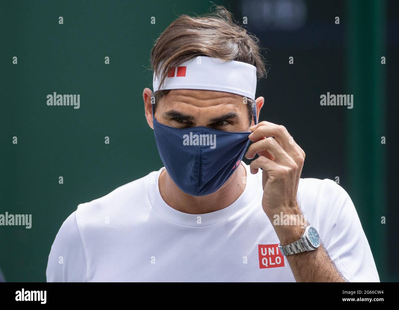Roger Federer wears a face mask after practicing on day six of Wimbledon at  The All England Lawn Tennis and Croquet Club, Wimbledon. Picture date:  Saturday July 3, 2021 Stock Photo - Alamy