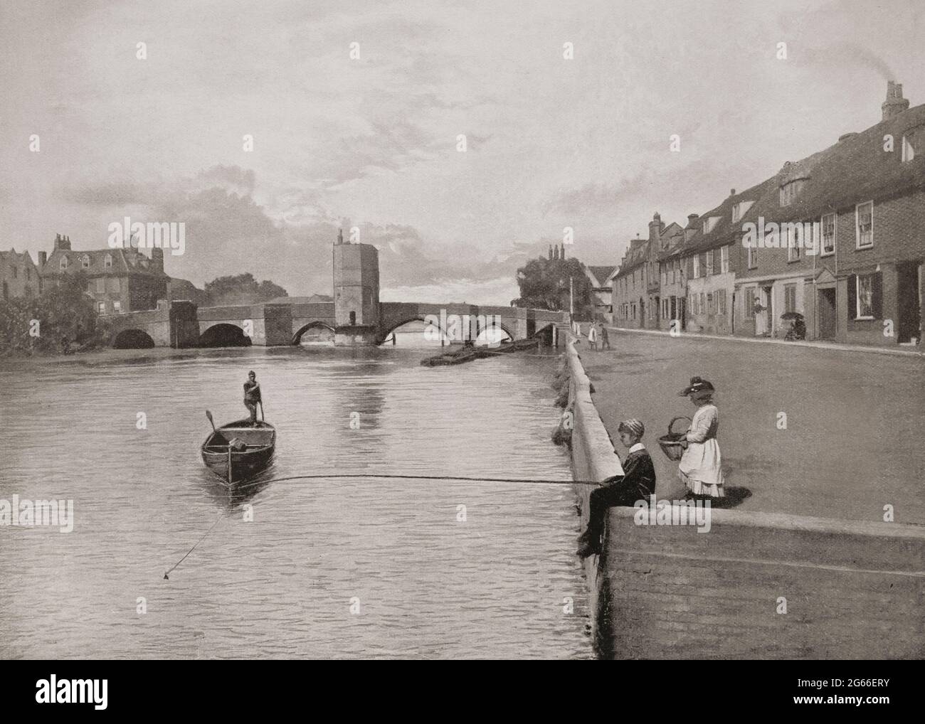 A late 19th century view of St Ives Bridge, completed in 1425, crossing the River Great Ouse in St Ives, Cambridgeshire, England with the bridge chapel in the centre. It went on to serve as a toll house, inn and private residence. Originally designed as a chapel and dedicated by the monks to Saint Leger, by 1736 it was being used as accommodation, and in that year two extra floors were added.During the 1850s and 1860s it was turned into a notorious public house named 'Little Hell', then a doctor's surgery. Stock Photo