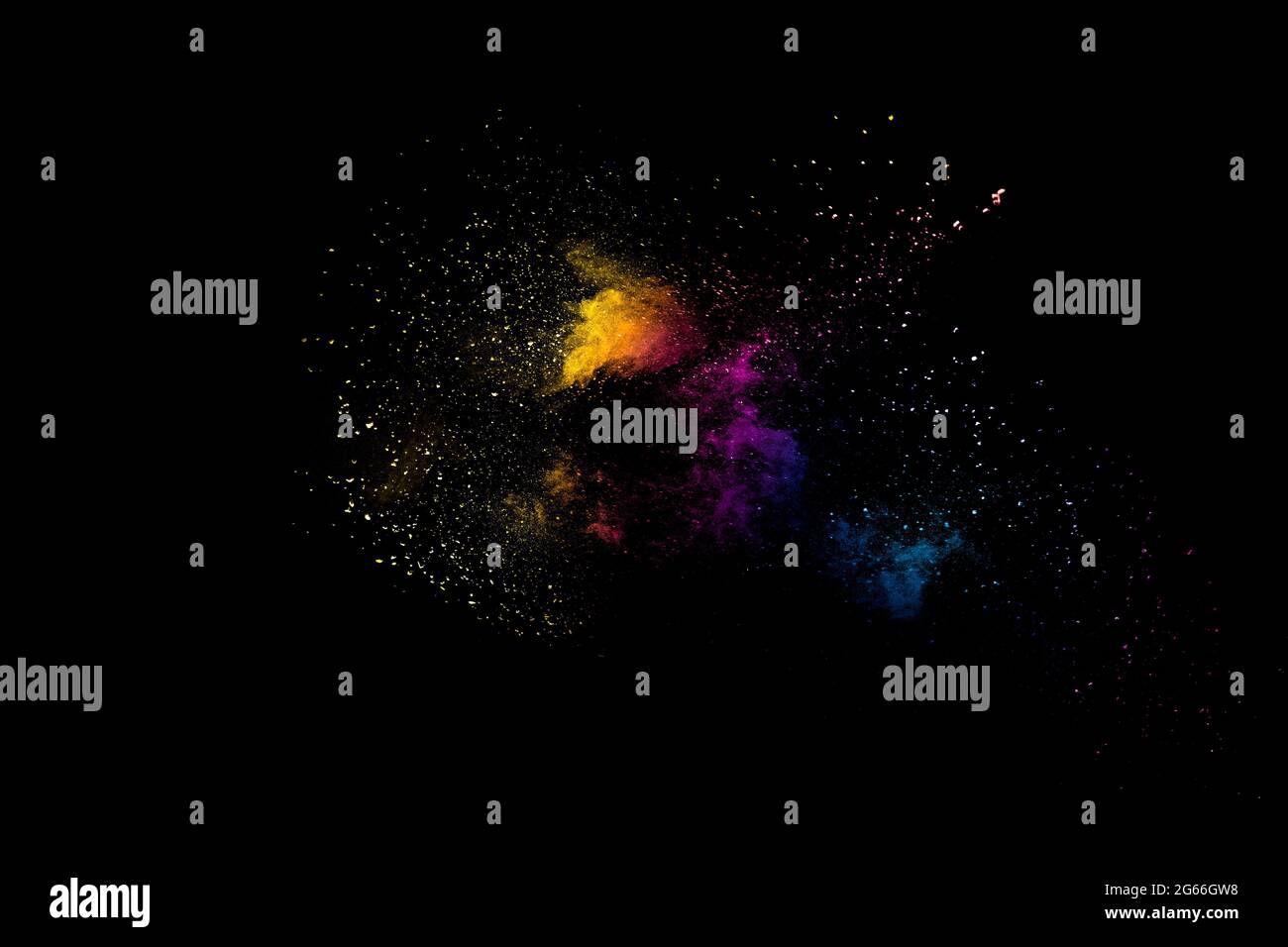 Launched multicolored powder on black background.Color powder explosion.Colorful dust splashing. Stock Photo
