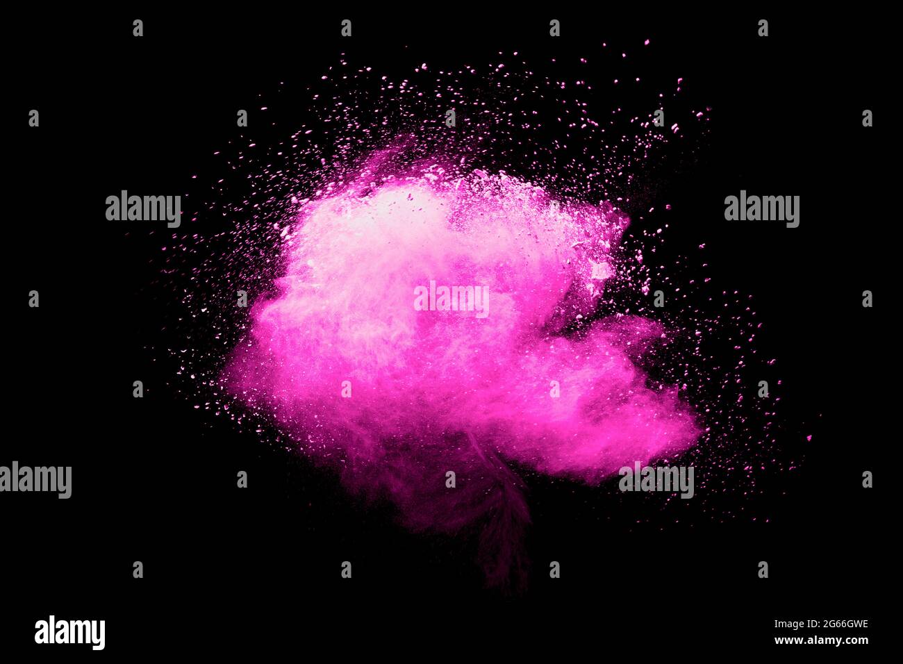 Pink powder explosion.Pink dust splash cloud on dark background. Stock Photo
