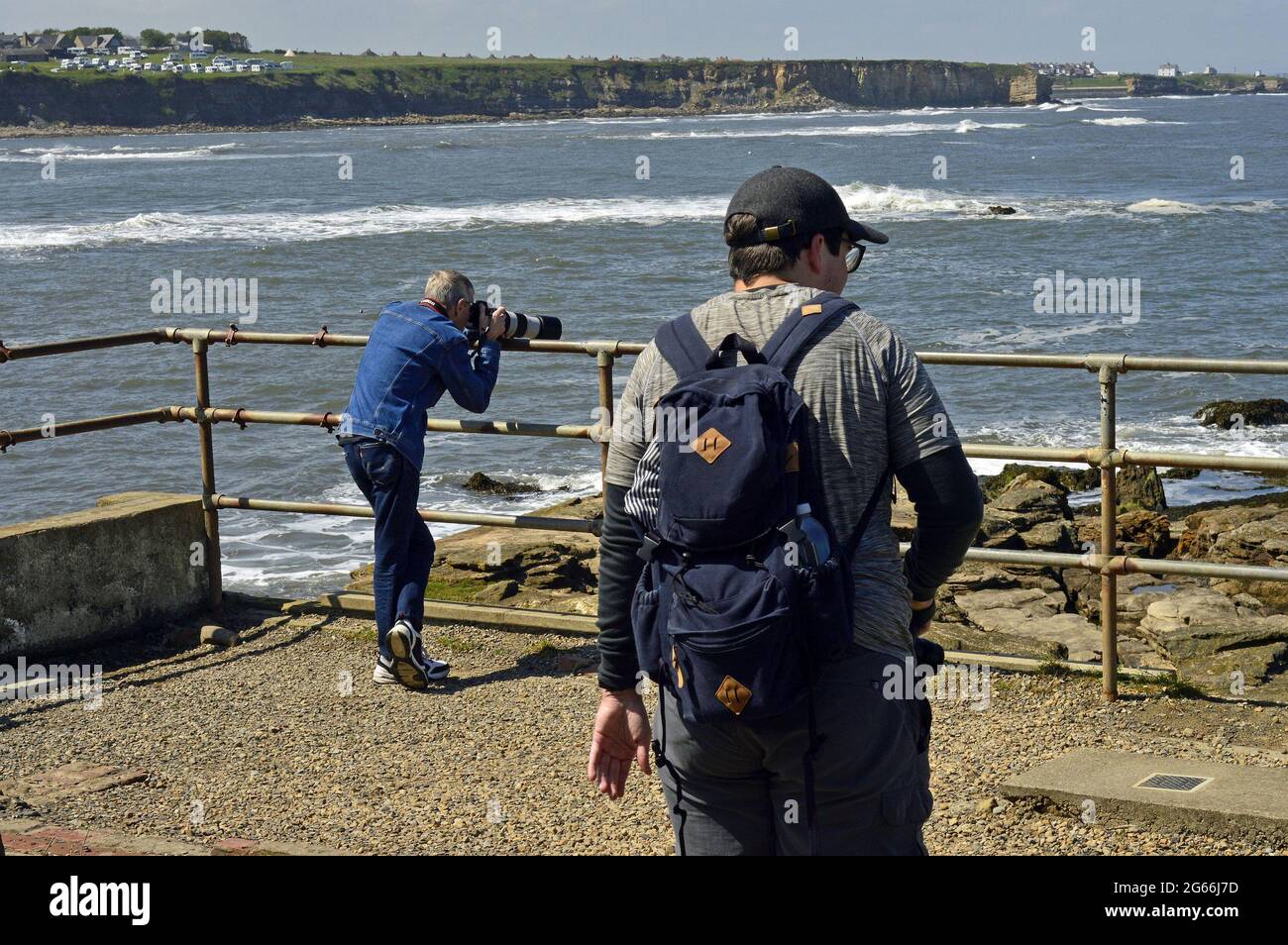 WHITLEY BAY. TYNE and WEAR. ENGLAND. 05-27-21. St. Mary's Island, two photographers at work photographing the local wildlife. Stock Photo