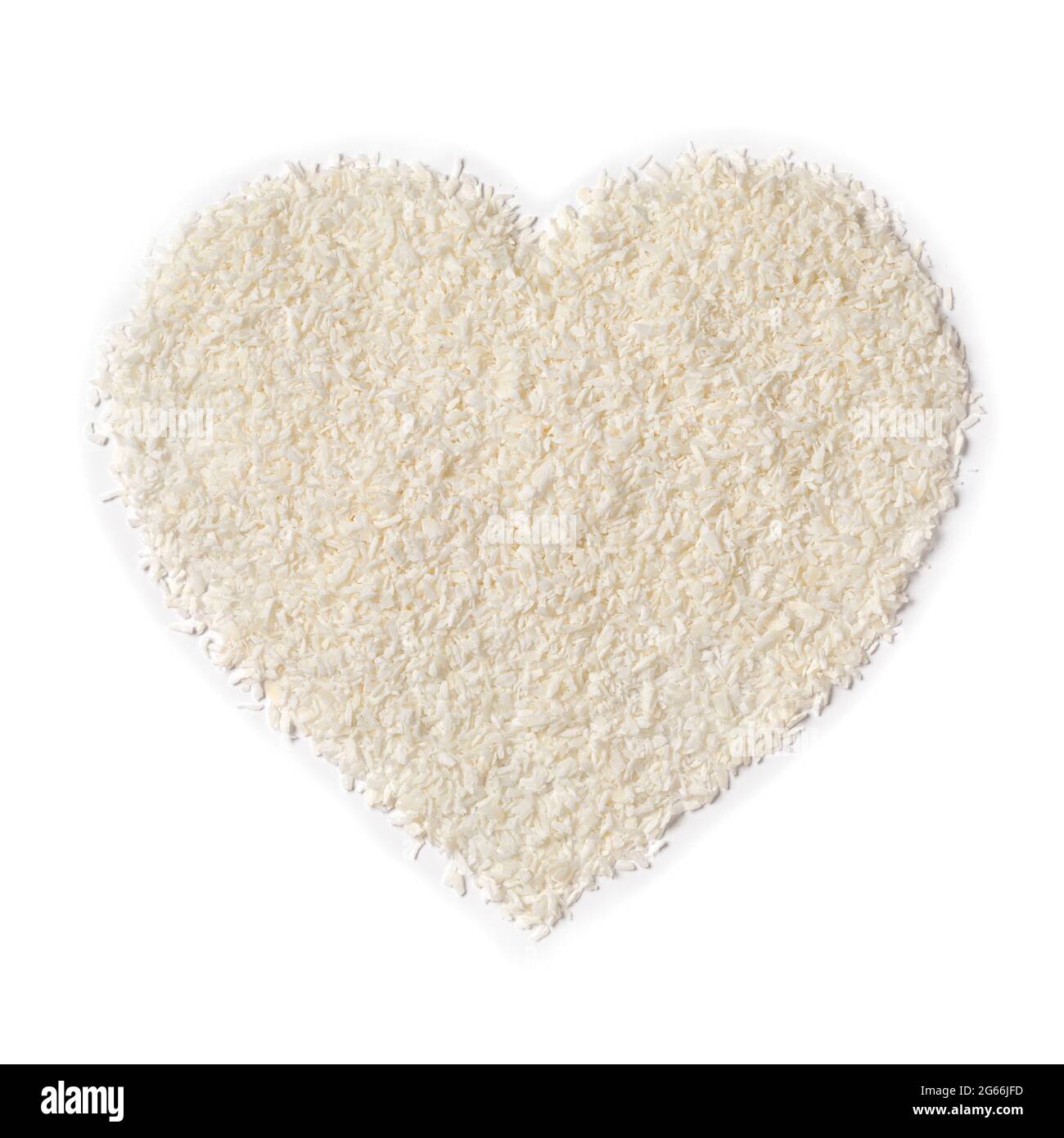 Shredded coconut in heart shape isolated on white background Stock Photo Alamy