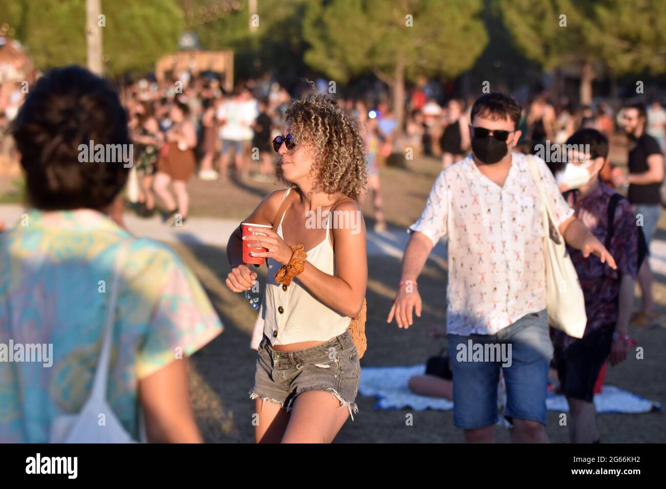 People are seen dancing at the Vida 2021 Festival.Vida 2021, an international festival that is held in the city of Vilanova i la Geltru (Barcelona) for three days and that with more than 50 live performances brings together author music, pop, rock, electronic music and indie music. Festival Vida 2021 tries to offer an experience of music, nature, sea, art and gastronomy in a bucolic setting in several stages in the same place. Stock Photo