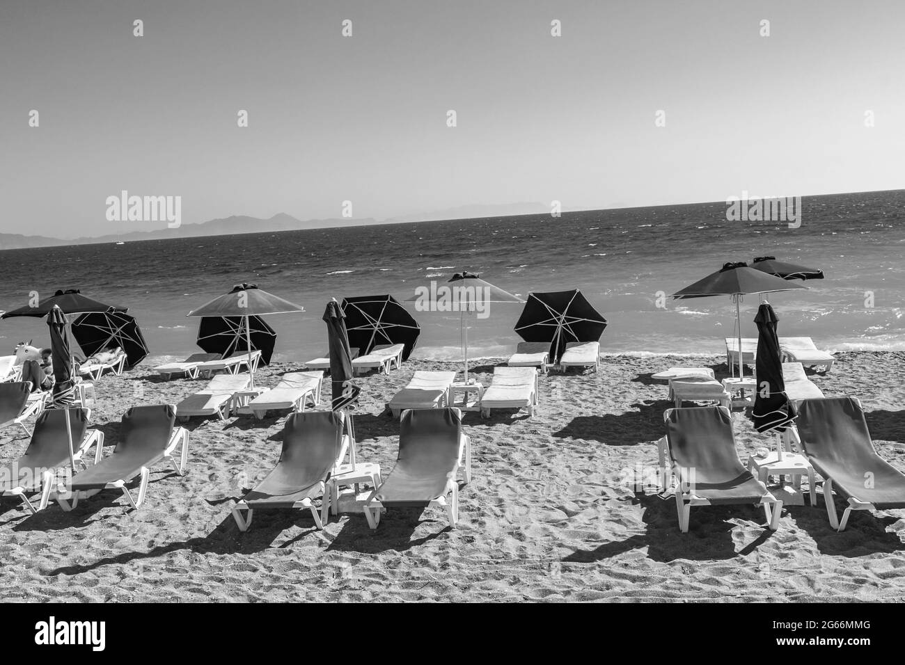Rhodes Greece 21. September 2018 Black and white picture of sun loungers at Elli beach in Rhodes Greece. Stock Photo