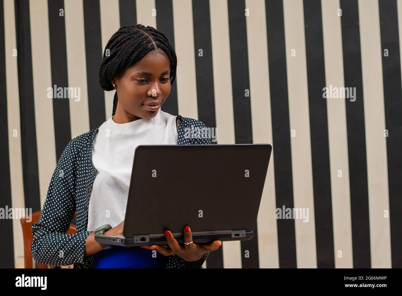 overexcited african lady in the office Stock Photo