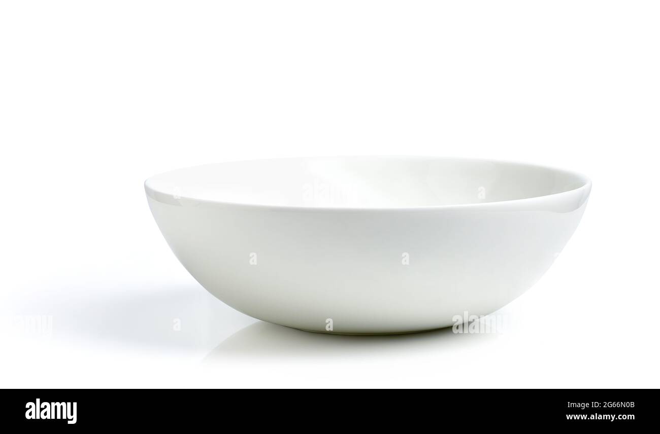 Empty white ceramic bowl isolated on white background Stock Photo
