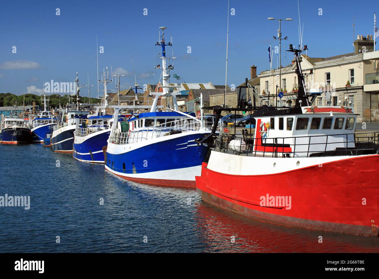 Blue and red fishing boats in Howth harbor, Dublin, Ireland Stock Photo