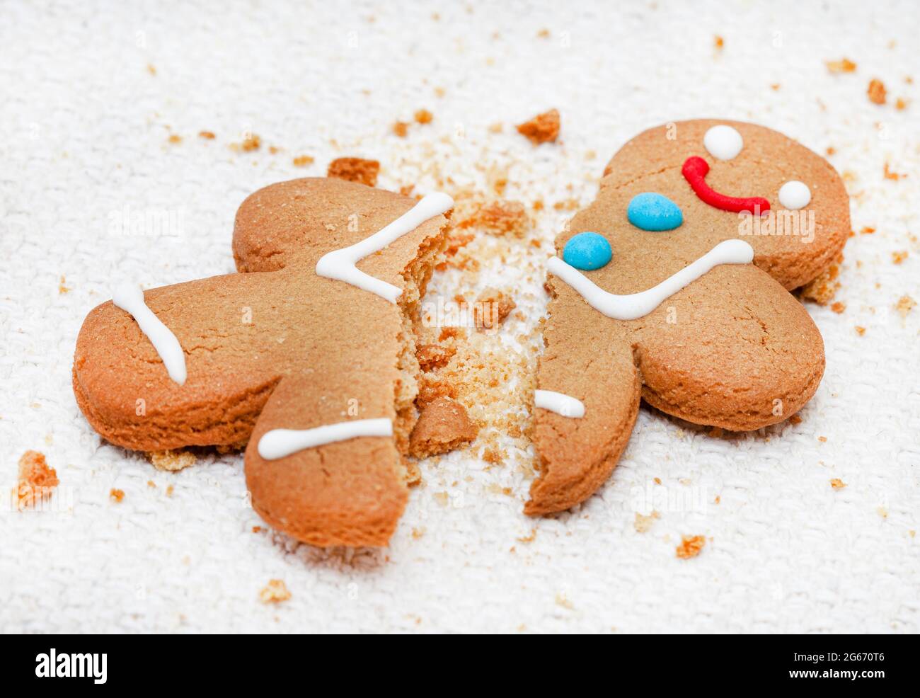 gingerbread man that's broken with crumbs Stock Photo Alamy