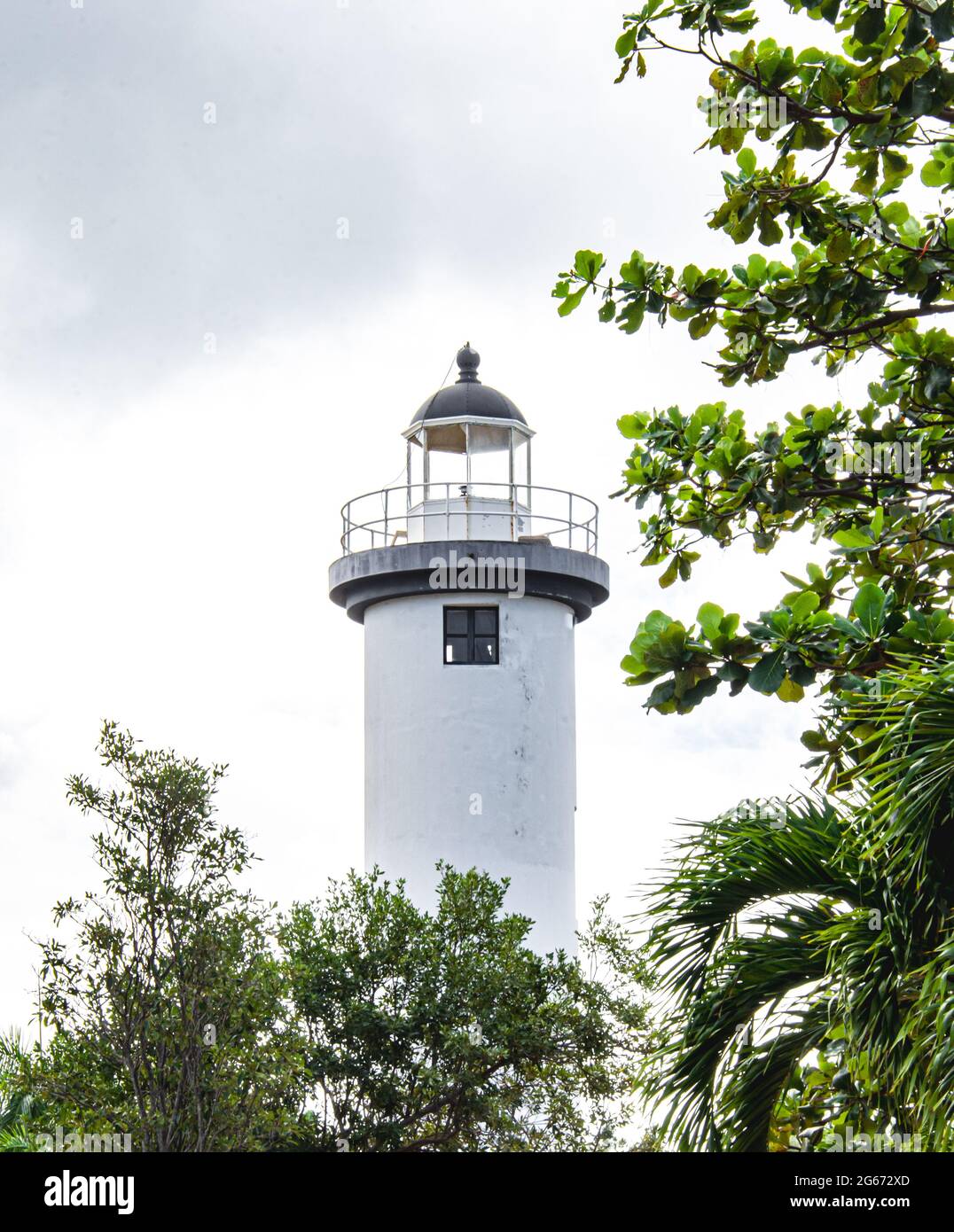 El Faro lighthouse framed by trees. Rincon, Puerto Rico, USA Stock Photo