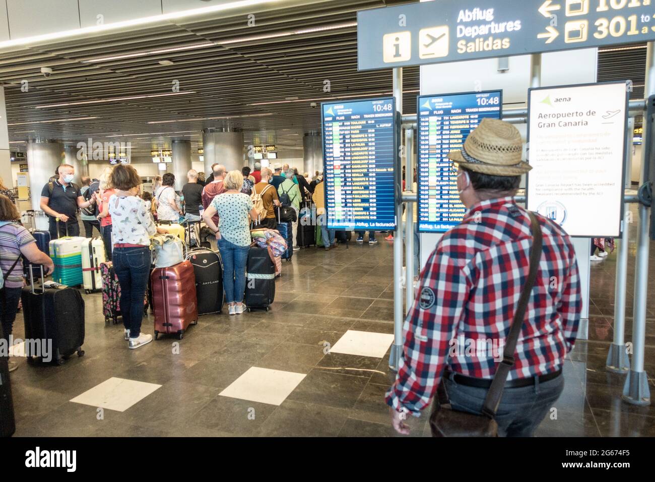Las Palmas, Gran Canaria, Canary Islands, Spain. 3rd July, 2021. German  tourists checking in for return flights to Germany at Gran Canaria airport.  The Canary Islands remain on the Amber list for