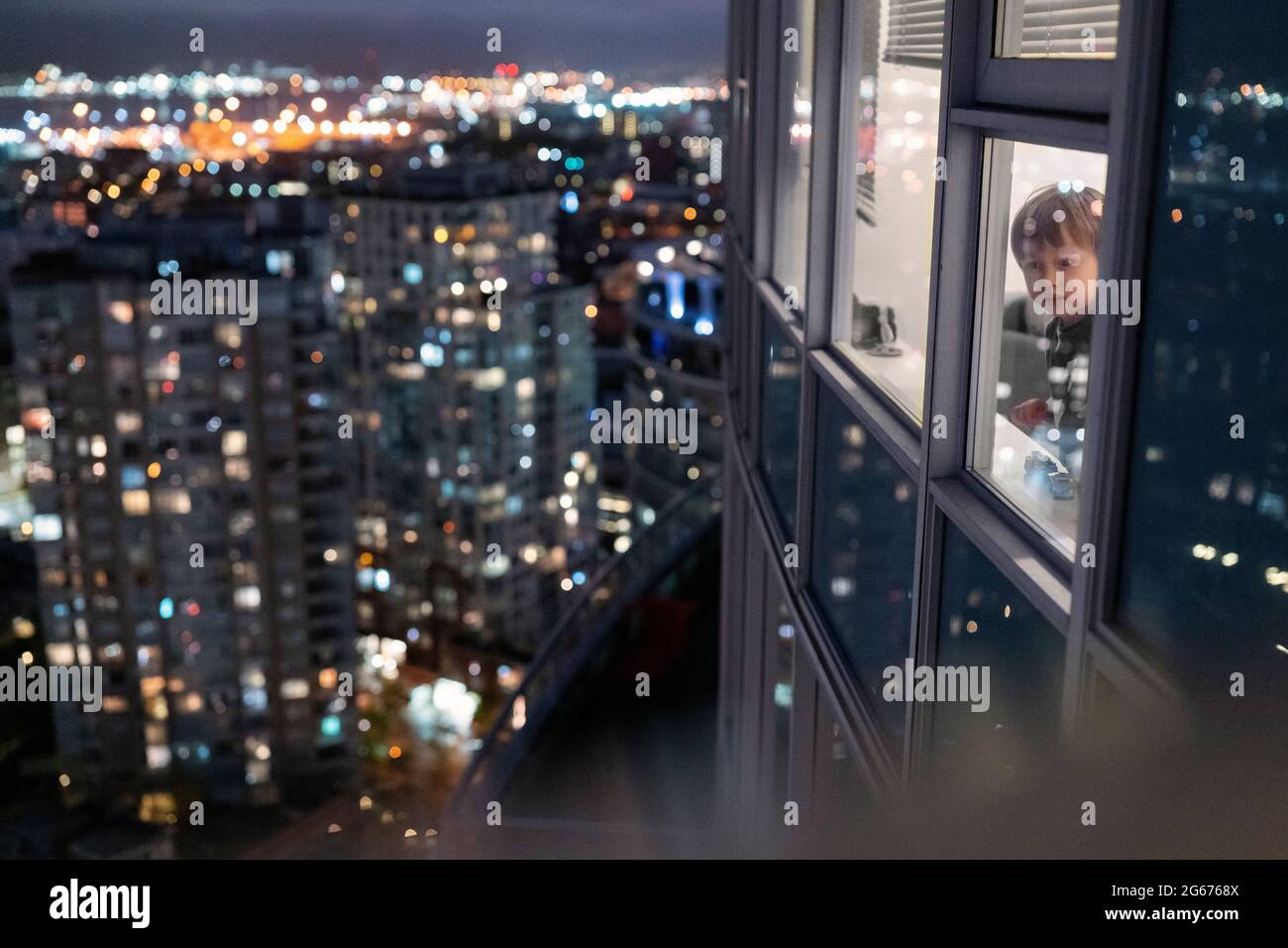 Child Looking Out Of City Window High Resolution Stock Photography And Images Alamy