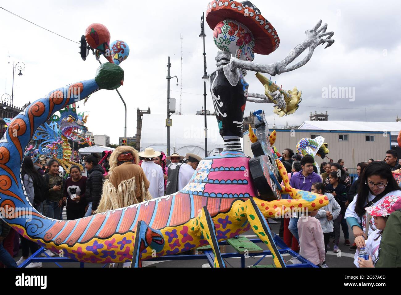 A large alebrije figure in the Day of the Dead parade in the zocalo in Mexico City. Stock Photo