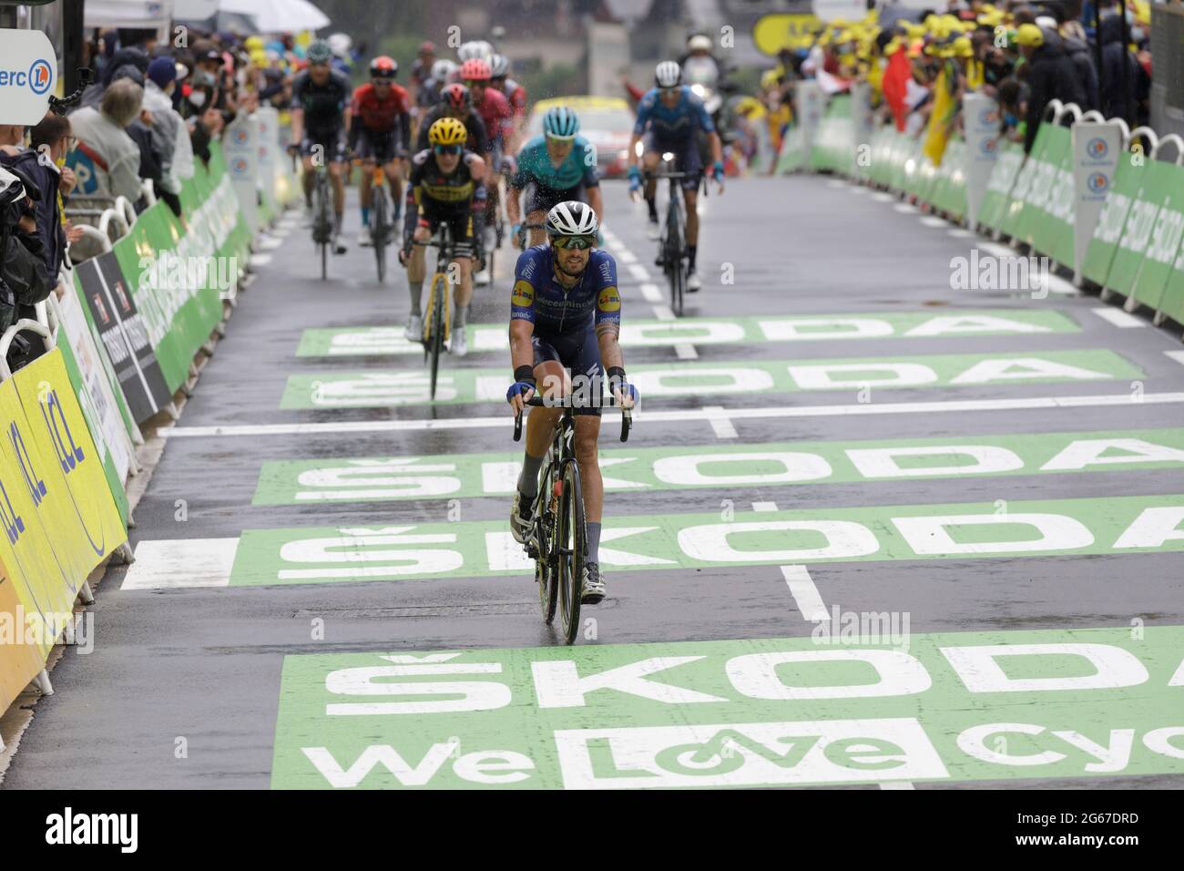 Le Grand-Bornand, France. 03 July 2021. Riders crossing the finish line of the 8th stage of the Tour de France in Le Grand-Bornand. Julian Elliott News Photography Credit: Julian Elliott/Alamy Live News Stock Photo
