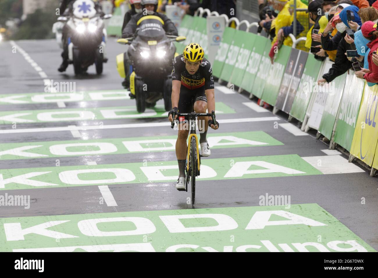 Le Grand-Bornand, France. 03 July 2021. Wout Van Aert crosses the finish line of the 8th stage of the Tour de France. Julian Elliott News Photography Credit: Julian Elliott/Alamy Live News Stock Photo