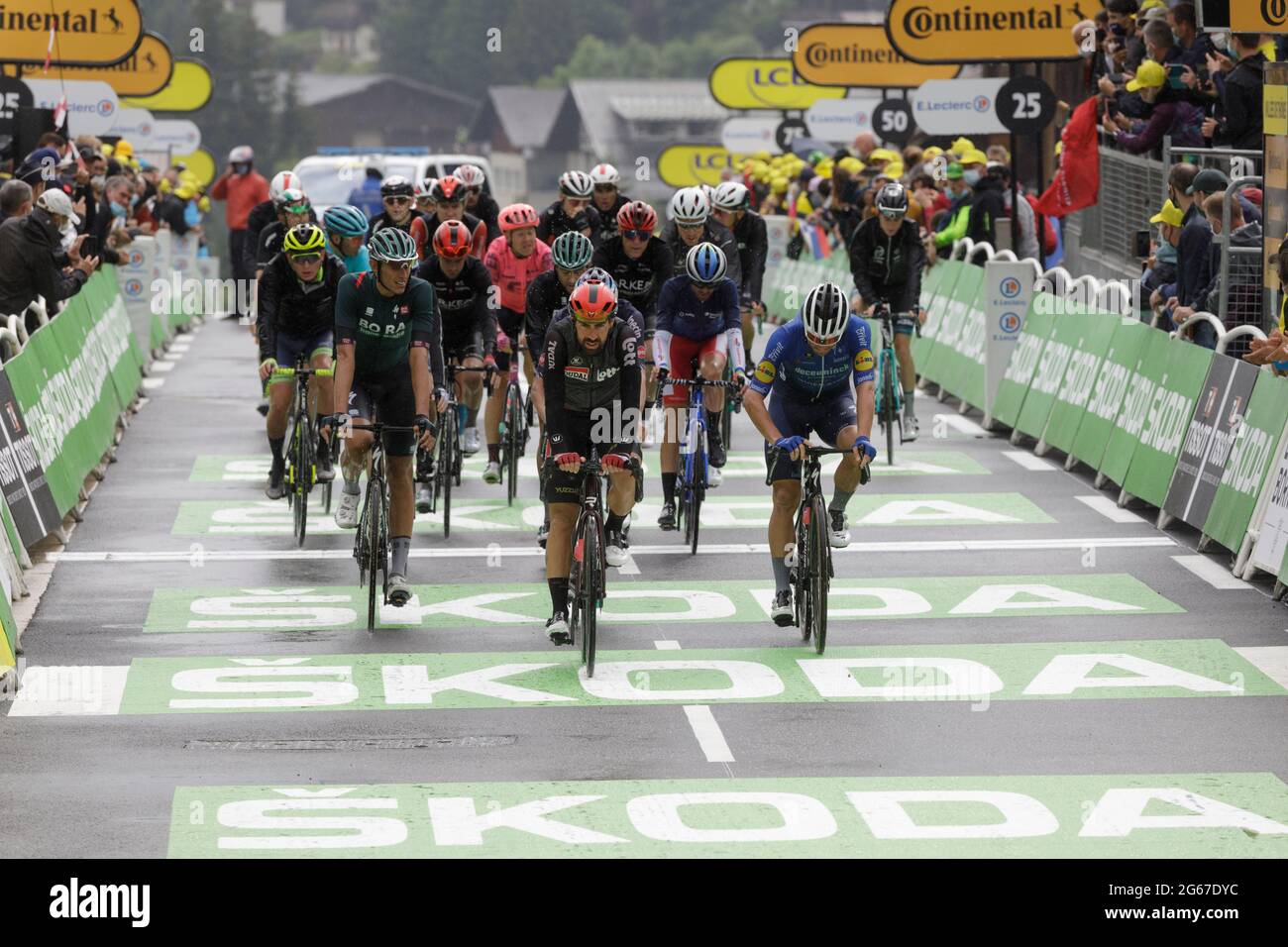 Le Grand-Bornand, France. 03 July 2021. The last of the riders approach the finish line of the 8th stage of the Tour de France. Julian Elliott News Photography Credit: Julian Elliott/Alamy Live News Stock Photo