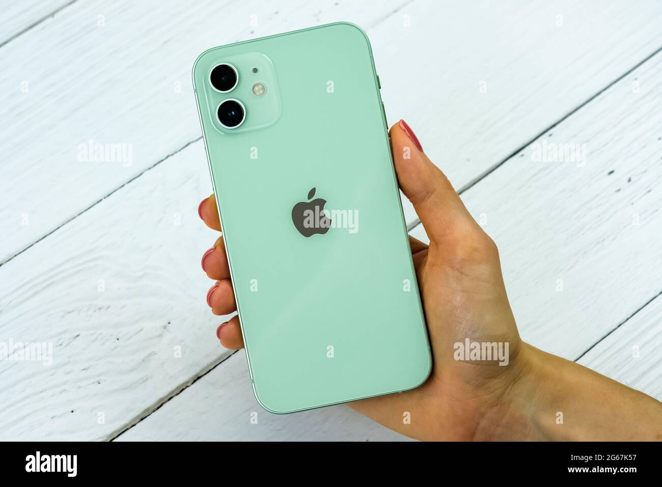 iPhone 12 in green color. Stock Photo