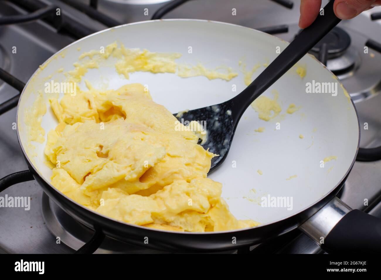 Making Scrambled Eggs in a pan Stock Photo Alamy