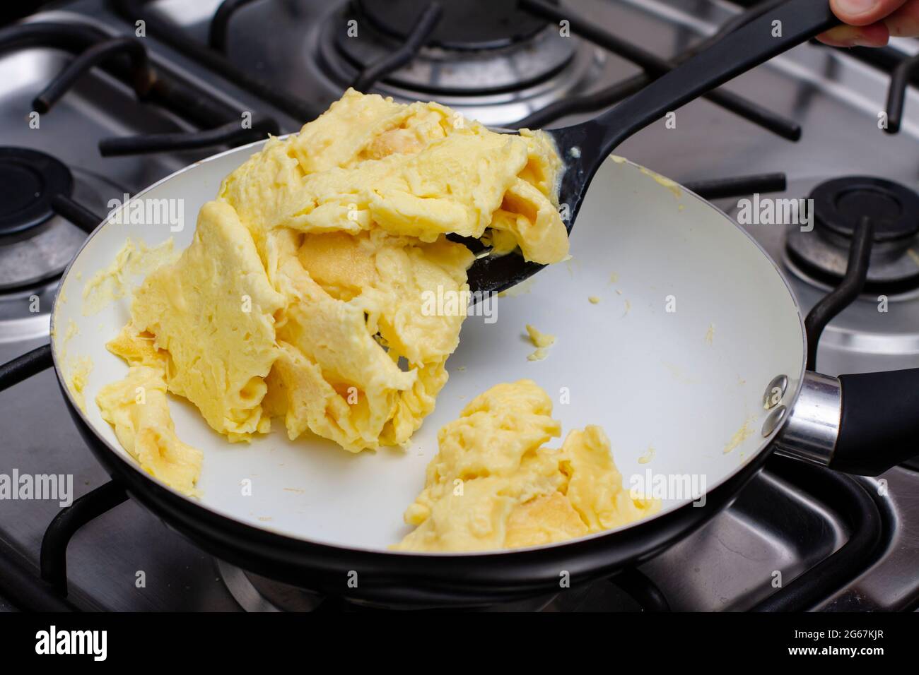 Making Scrambled Eggs in a pan Stock Photo Alamy
