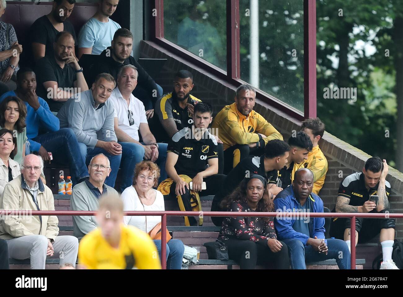 ZUNDERT, NETHERLANDS - JULY 3: Mario Bilate of NAC Breda and Ralf Seuntjens of NAC Breda watching from the stands during the Pre Season Friendly match between Zundertse Selectie and NAC Breda at the Sportpark De Wildert on July 3, 2021 in Zundert, Netherlands (Photo by Rene Nijhuis/Orange Pictures) Stock Photo