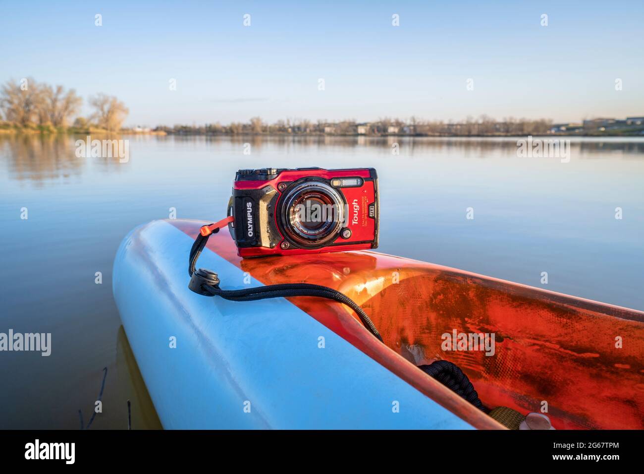 Fort Collins, CO, USA - May 6, 2021: Compact, waterproof Olympus Stylus Tough TG-5 camera on a rear deck of a stand up paddleboard by Mistral, early s Stock Photo