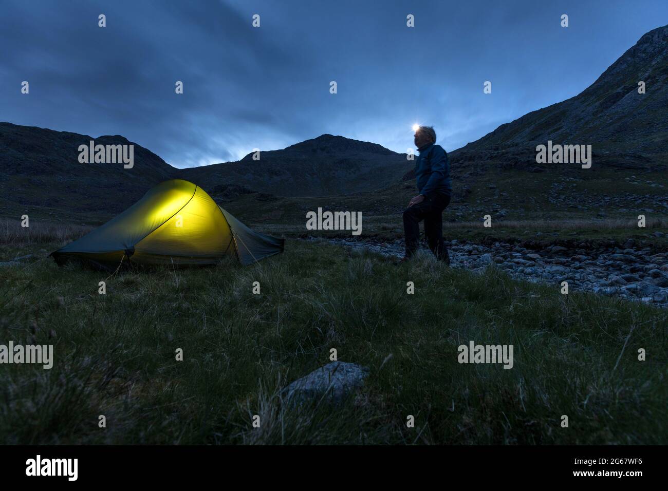 Night falls on a wild camp in the English Lake District Stock Photo