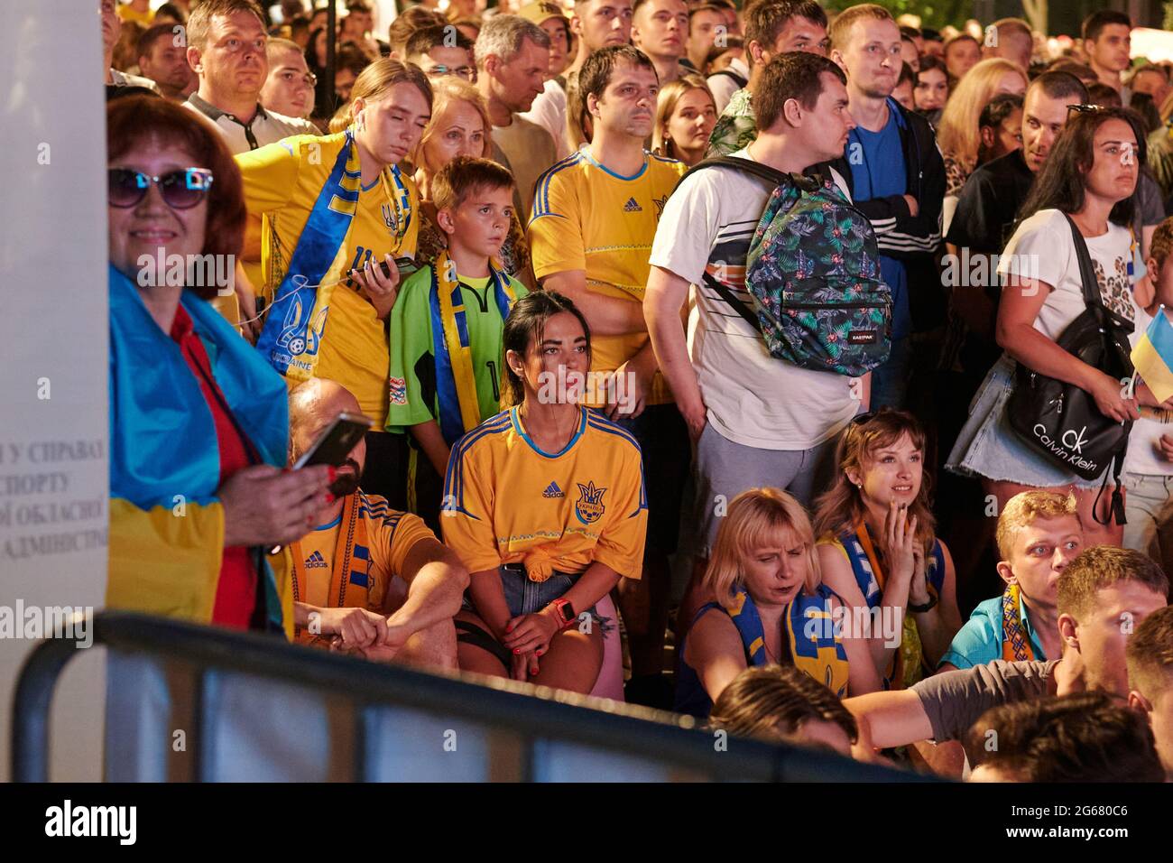 KHARKIV, UKRAINE - JULY 3, 2021: EURO 2020 Ukraine - England. Ukrainian soccer fans cheer at the Fan Zone in Kharkiv Stock Photo