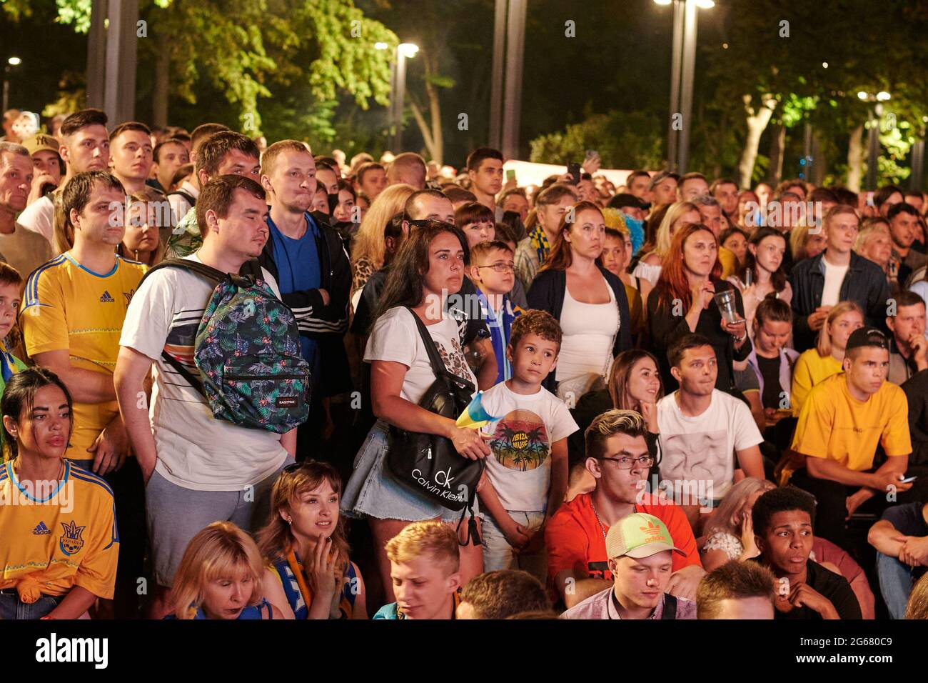 KHARKIV, UKRAINE - JULY 3, 2021: EURO 2020 Ukraine - England. Ukrainian soccer fans cheer at the Fan Zone in Kharkiv Stock Photo
