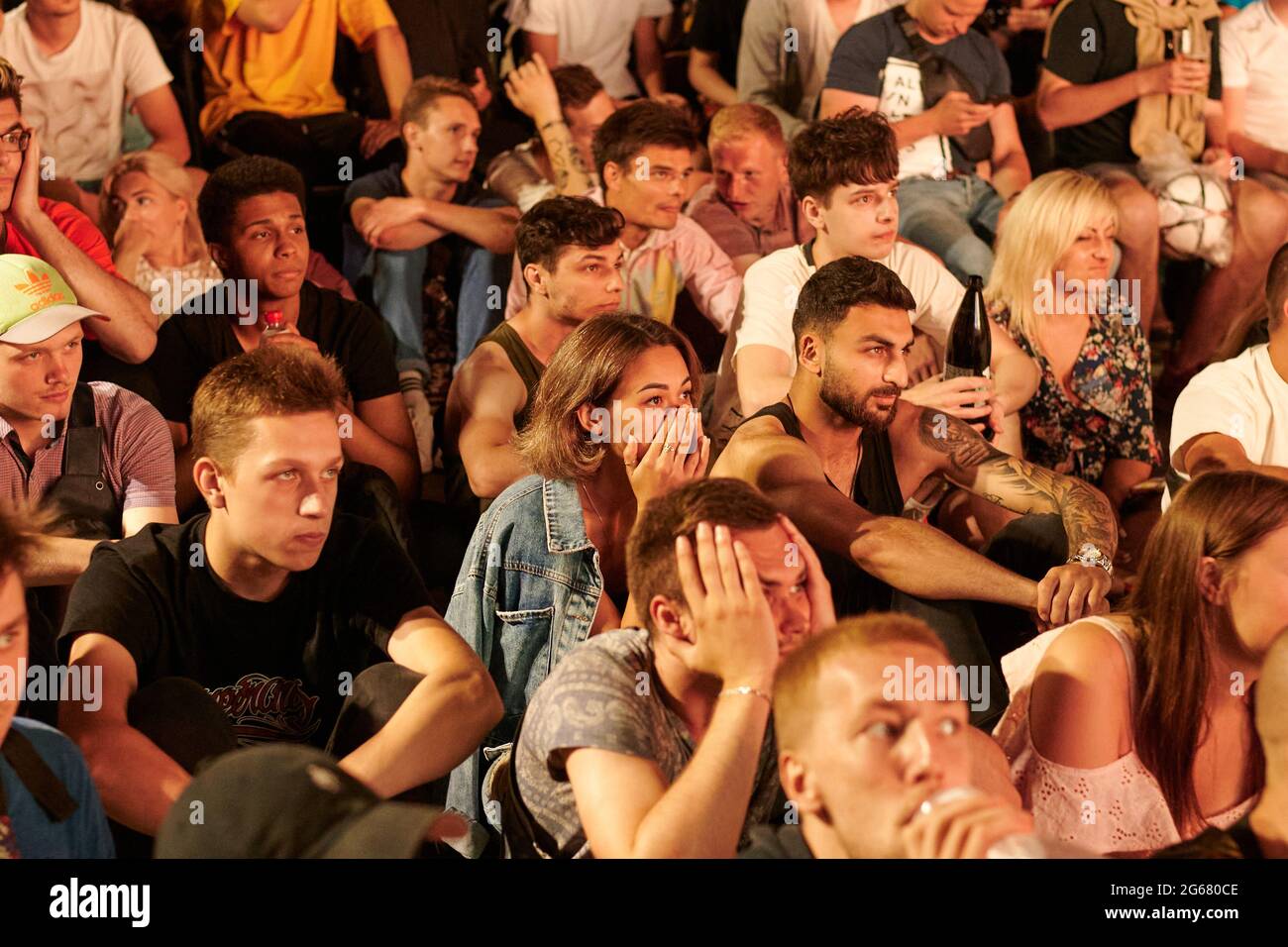 KHARKIV, UKRAINE - JULY 3, 2021: EURO 2020 Ukraine - England. Ukrainian soccer fans cheer at the Fan Zone in Kharkiv Stock Photo