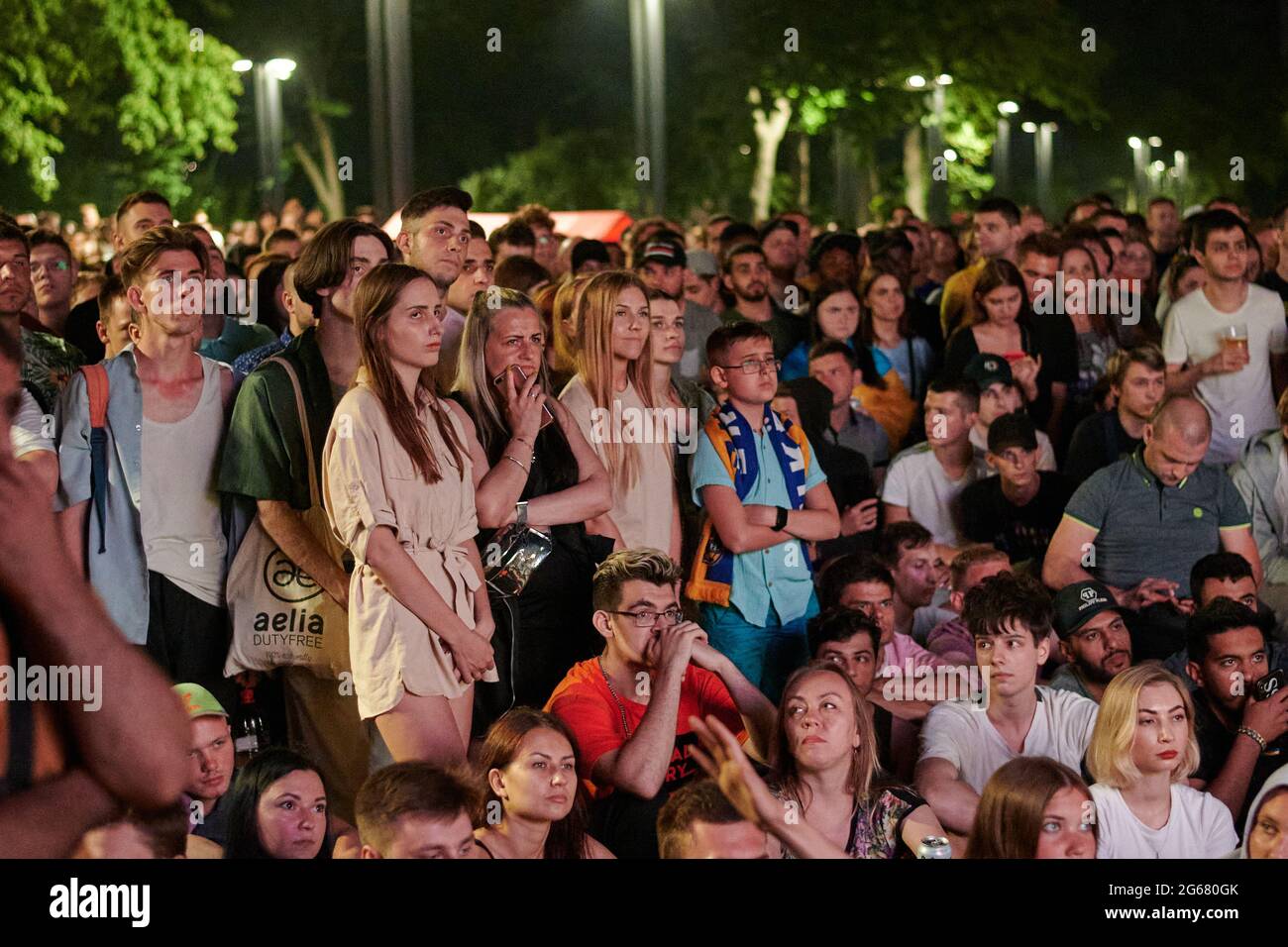 KHARKIV, UKRAINE - JULY 3, 2021: EURO 2020 Ukraine - England. Ukrainian soccer fans cheer at the Fan Zone in Kharkiv Stock Photo