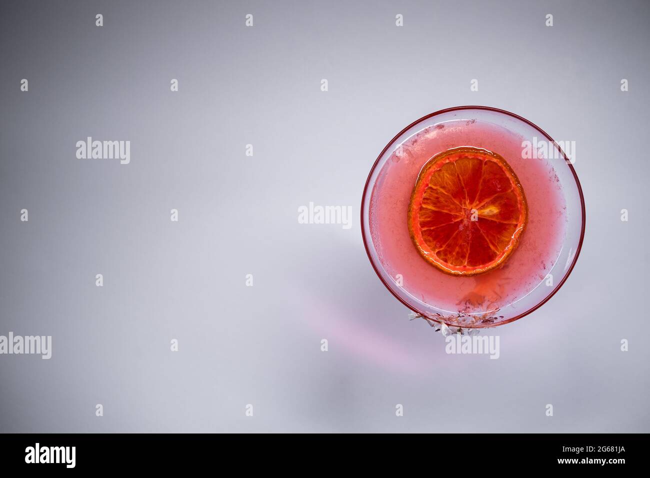 hemingway daiquiri cocktail drink with grapefruit in glass on white