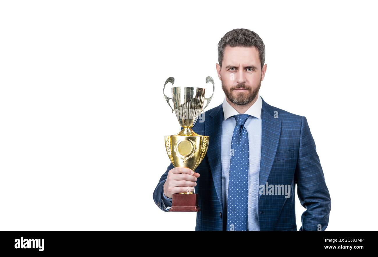 achievement. copy space. mature businessman in suit hold golden cup. business success. Stock Photo