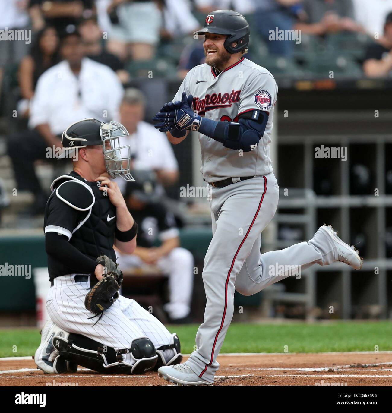 The Minnesota Twins' Josh Donaldson celebrates as he crosses home plate  following his two-run home run in the first inning against the Chicago  White Sox at Guaranteed Rate Field in Chicago on