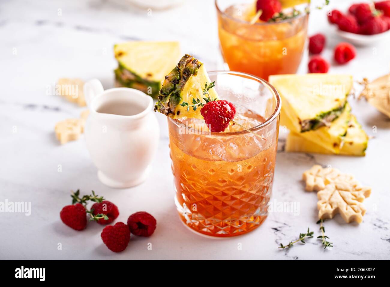 Pineapple, raspberry and honey cocktail or mocktail Stock Photo