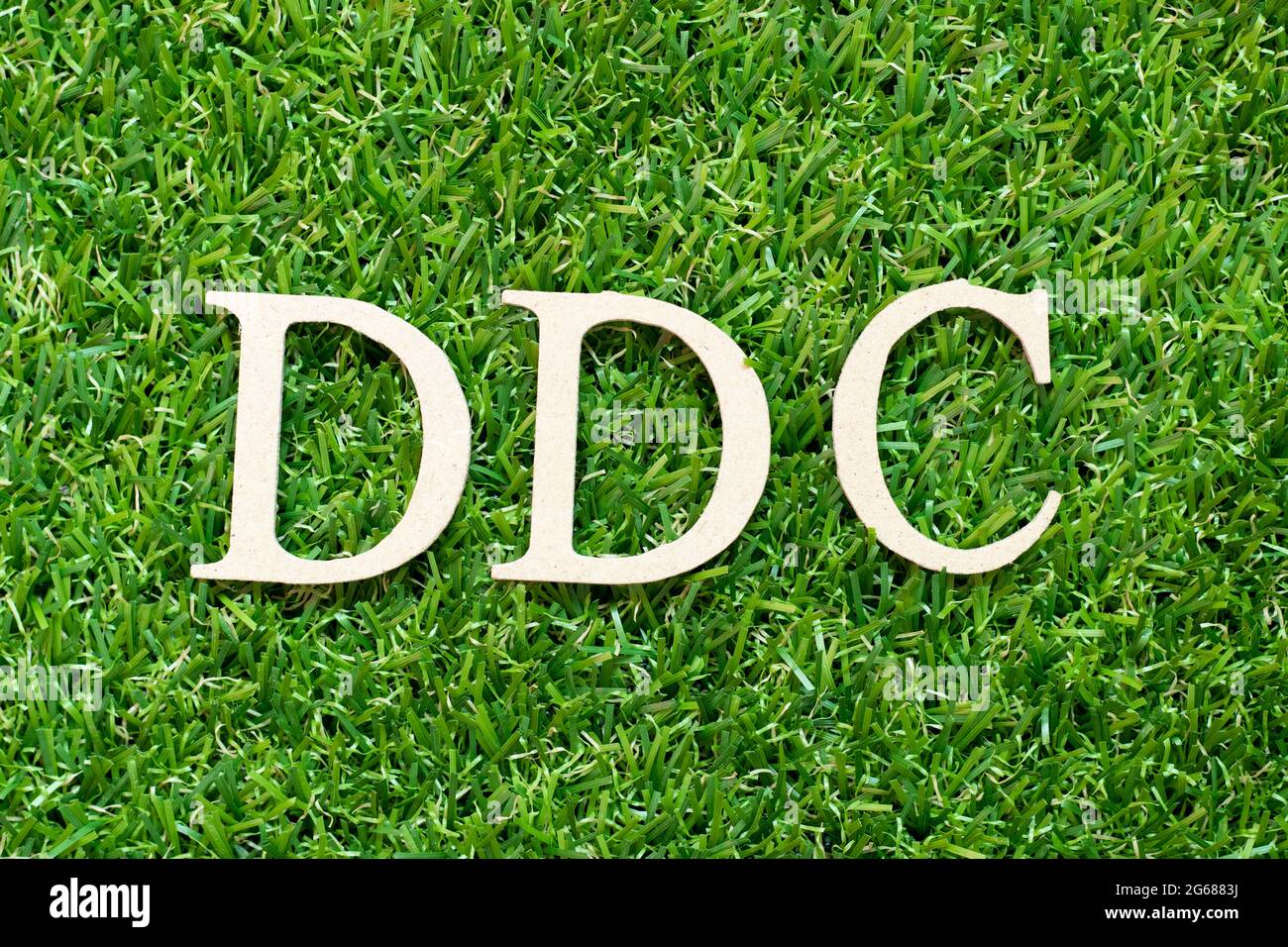 Alphabet letter in word DDC (Abbreviation of Division of disease control,  Direct digital control, Display Data Channel or Dewey Decimal Classificatio  Stock Photo - Alamy
