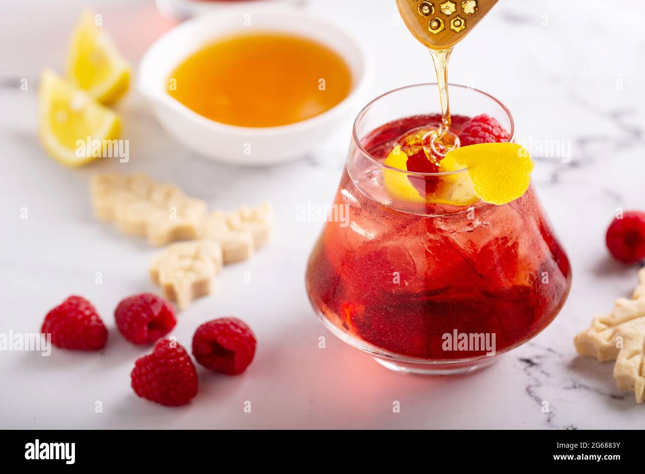 Raspberry, honey and lemon cocktail or mocktail Stock Photo