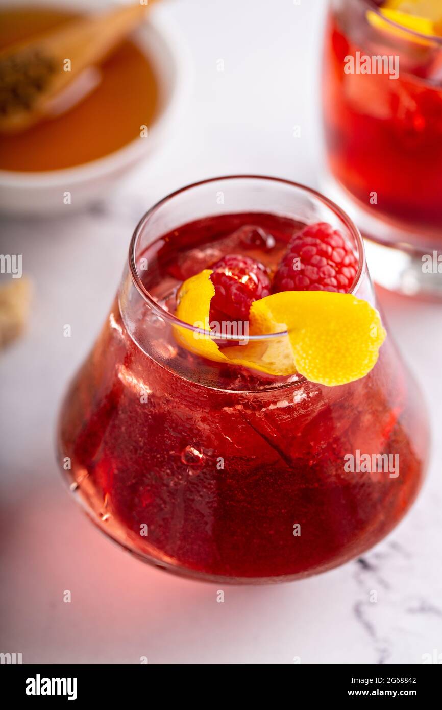 Raspberry, honey and lemon cocktail or mocktail Stock Photo